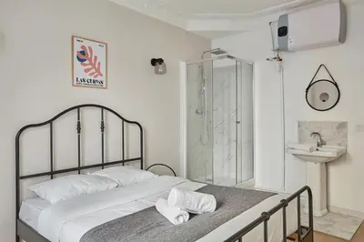 Un ou plusieurs lits dans un hébergement de l'établissement Apartment Parc des expositions by Studio prestige