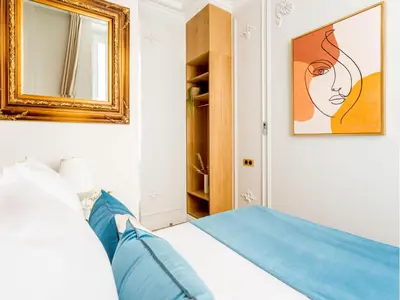 Un ou plusieurs lits dans un hébergement de l'établissement Merveil - Luxury Suite -Opera - Volney II