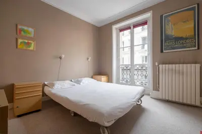 Un ou plusieurs lits dans un hébergement de l'établissement Veeve - Peaches of Paris