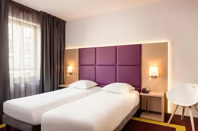 Un ou plusieurs lits dans un hébergement de l'établissement Aparthotel Adagio Paris Malakoff Chatillon
