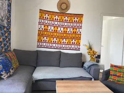Coin salon dans l'établissement SUPER APPARTEMENT AU COEUR DE MONTMARTRE
