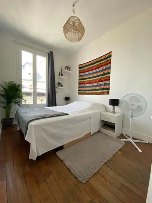 Un ou plusieurs lits dans un hébergement de l'établissement SUPER APPARTEMENT AU COEUR DE MONTMARTRE