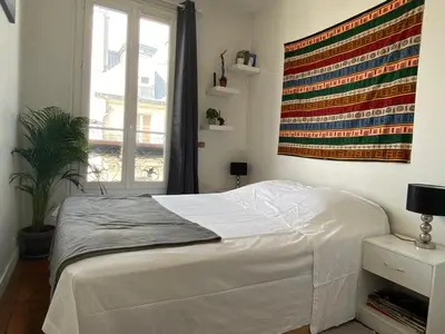 Un ou plusieurs lits dans un hébergement de l'établissement SUPER APPARTEMENT AU COEUR DE MONTMARTRE