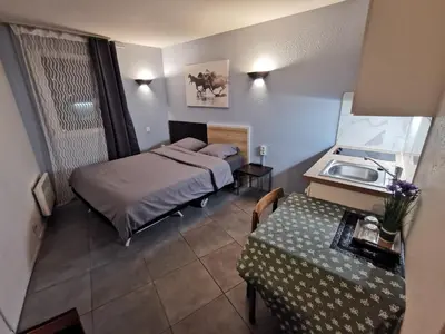 Un ou plusieurs lits dans un hébergement de l'établissement Appart Hotel La Defense