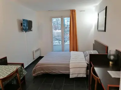 Un ou plusieurs lits dans un hébergement de l'établissement Appart Hotel La Defense