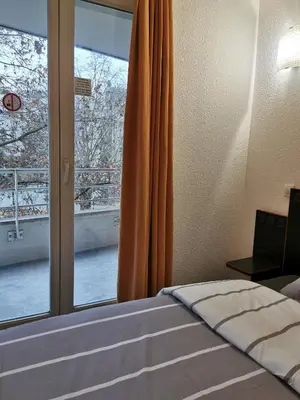 Un ou plusieurs lits dans un hébergement de l'établissement Appart Hotel La Defense