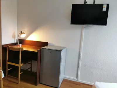 Télévision ou salle de divertissement dans l'établissement Appart Hotel La Defense