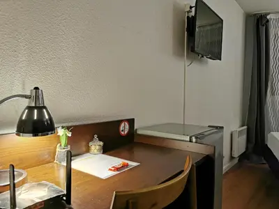Télévision ou salle de divertissement dans l'établissement Appart Hotel La Defense