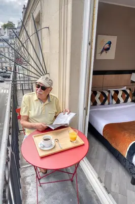 Un ou plusieurs lits dans un hébergement de l'établissement Hotel Phenix Paris