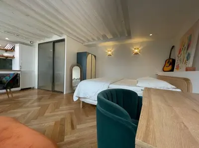 Un ou plusieurs lits dans un hébergement de l'établissement CozyStudioParis-Montmartre-Opera