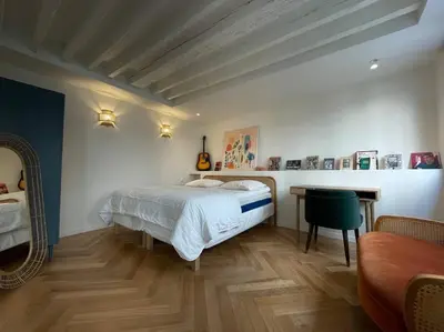 Un ou plusieurs lits dans un hébergement de l'établissement CozyStudioParis-Montmartre-Opera