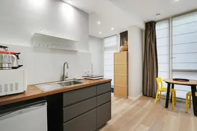 Cuisine ou kitchenette dans l'établissement Pick A Flat's Apartment near Eiffel Tower - Allée Marguerite Yourcenar
