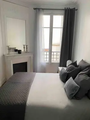 Un ou plusieurs lits dans un hébergement de l'établissement Charmant appartement cosy 2 pièces Paris 15e