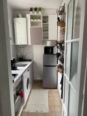 Cuisine ou kitchenette dans l'établissement Charmant appartement cosy 2 pièces Paris 15e