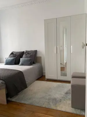 Un ou plusieurs lits dans un hébergement de l'établissement Charmant appartement cosy 2 pièces Paris 15e