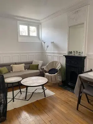 Coin salon dans l'établissement Charmant appartement cosy 2 pièces Paris 15e