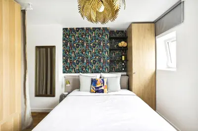 Un ou plusieurs lits dans un hébergement de l'établissement Luxury architect studio near Le Marais