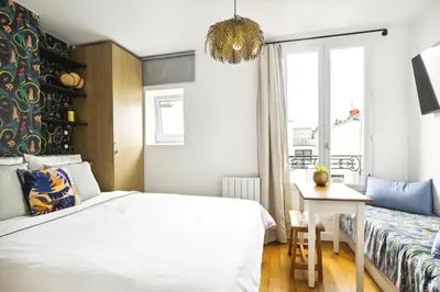 Un ou plusieurs lits dans un hébergement de l'établissement Luxury architect studio near Le Marais