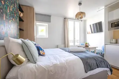 Un ou plusieurs lits dans un hébergement de l'établissement Luxury architect studio near Le Marais