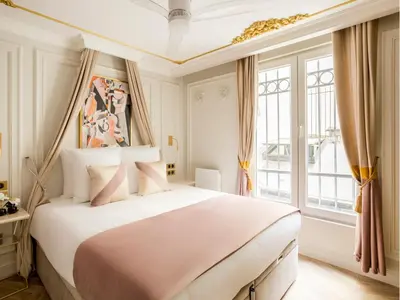 Un ou plusieurs lits dans un hébergement de l'établissement Merveil - Luxury Suite - Opera - Rougemont II