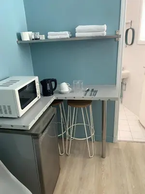 Cuisine ou kitchenette dans l'établissement Hôtel Eiffel XV