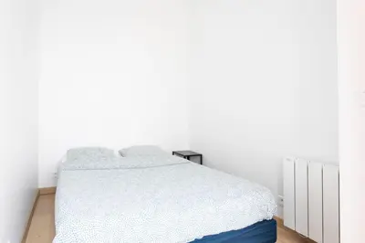 Un ou plusieurs lits dans un hébergement de l'établissement Superbe appartement Hamelin Paris 16eme
