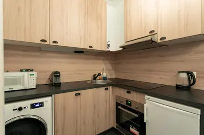 Cuisine ou kitchenette dans l'établissement Superbe appartement Hamelin Paris 16eme