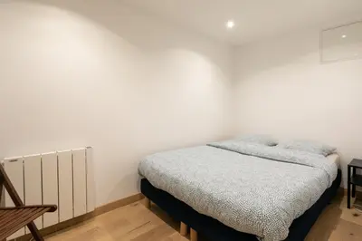 Un ou plusieurs lits dans un hébergement de l'établissement Superbe appartement Hamelin Paris 16eme