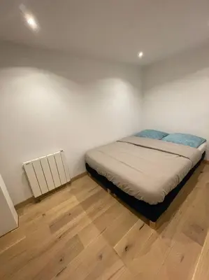Un ou plusieurs lits dans un hébergement de l'établissement Appartement paris 16 eme