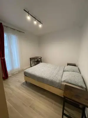 Un ou plusieurs lits dans un hébergement de l'établissement Paris Nordmann superbe appartement 2 pièces
