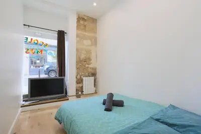 Un ou plusieurs lits dans un hébergement de l'établissement Appartement Broca
