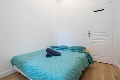 Un ou plusieurs lits dans un hébergement de l'établissement Appartement Broca