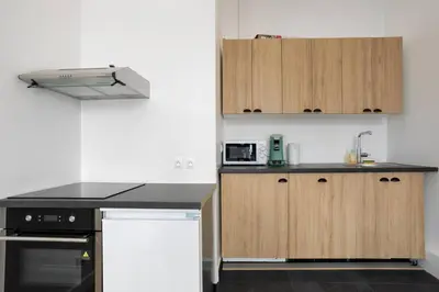 Cuisine ou kitchenette dans l'établissement Appartement Broca