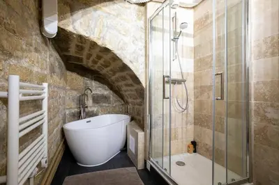 Salle de bains dans l'établissement Appartement Broca