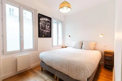 Un ou plusieurs lits dans un hébergement de l'établissement Loft 4 BR Montmartre Pigalle AC by LCC Agency