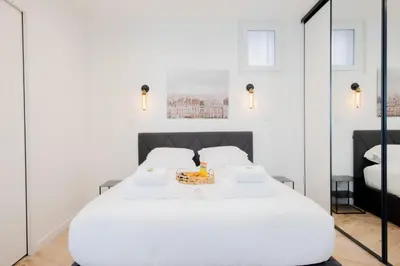 Un ou plusieurs lits dans un hébergement de l'établissement Appartement confortable 1BR-4P - Boulogne-Billancourt