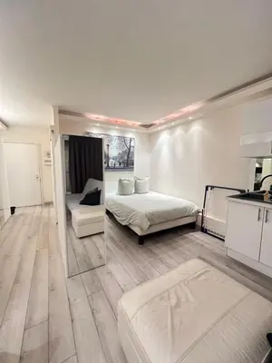Un ou plusieurs lits dans un hébergement de l'établissement Apartment Like HOME Arc de Triomphe, Champs Élysées, Tour Eiffel