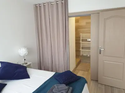 Un ou plusieurs lits dans un hébergement de l'établissement cosy appartment - Clamart Percy Paris