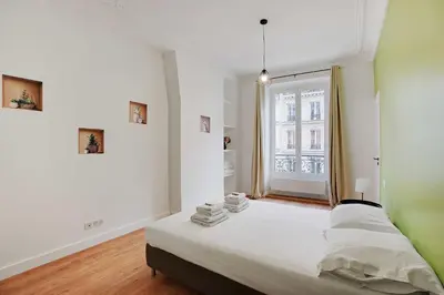 Un ou plusieurs lits dans un hébergement de l'établissement Magnificent flat - 3BR-8P - Montorgueil