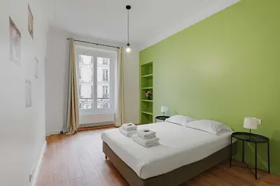 Un ou plusieurs lits dans un hébergement de l'établissement Magnificent flat - 3BR-8P - Montorgueil