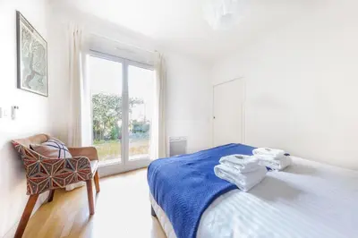Un ou plusieurs lits dans un hébergement de l'établissement Quiet apartment - 1BR-6P - Vanves