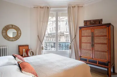 Un ou plusieurs lits dans un hébergement de l'établissement Appartement de charme à Montmartre