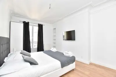 Un ou plusieurs lits dans un hébergement de l'établissement Cozy apartment 1BR 4P - Palais Royal