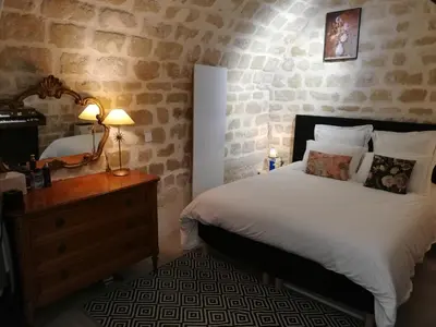 Un ou plusieurs lits dans un hébergement de l'établissement Les Frères Montgolfier - Le Marais - 80 m2