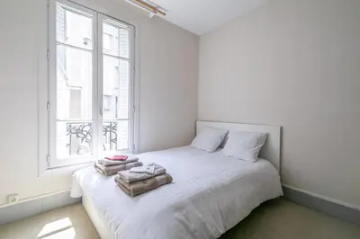 Un ou plusieurs lits dans un hébergement de l'établissement Appartement Ivry