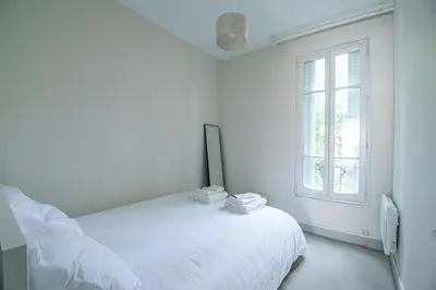 Un ou plusieurs lits dans un hébergement de l'établissement Appartement Ivry