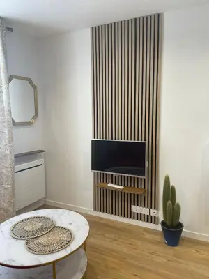 Télévision ou salle de divertissement dans l'établissement Montmartre Cosy