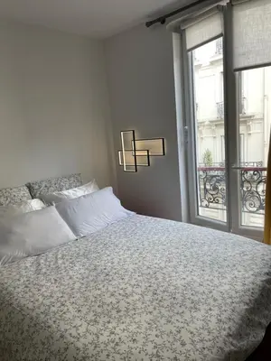 Un ou plusieurs lits dans un hébergement de l'établissement Montmartre Cosy