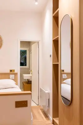 Un ou plusieurs lits dans un hébergement de l'établissement Amazing studio - 2P - Arc de Triomphe