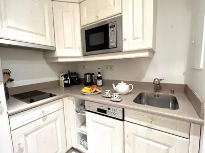 Cuisine ou kitchenette dans l'établissement L'appartement Pierre Charron C